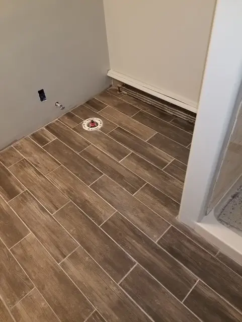 Finished wood-look bathroom tile floor