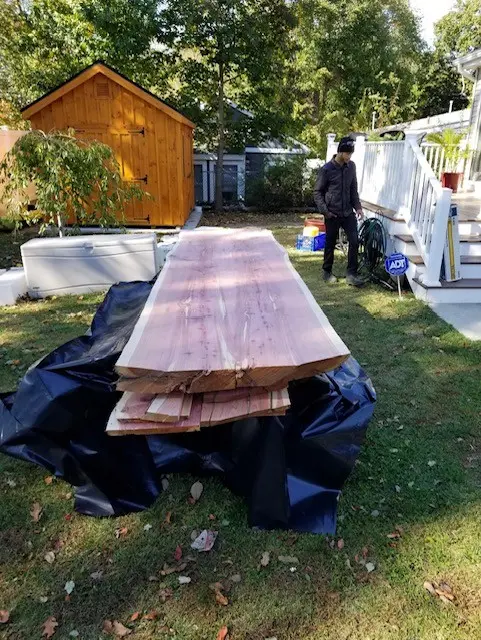 Live-edge cedar slab selected for the custom bar top