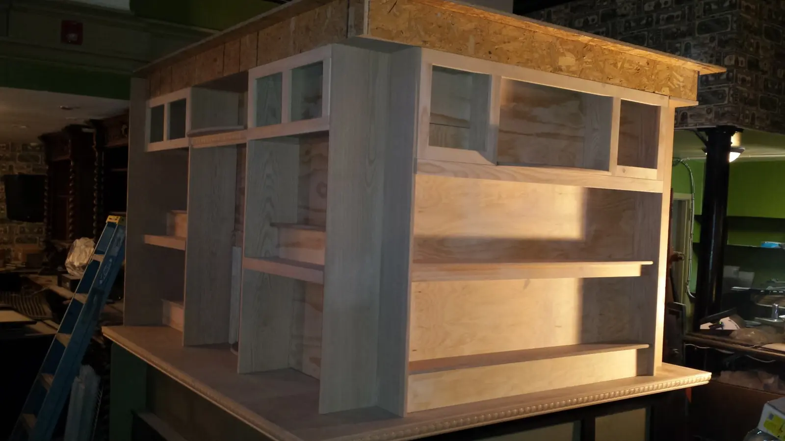 Custom wood bar cabinetry under construction
